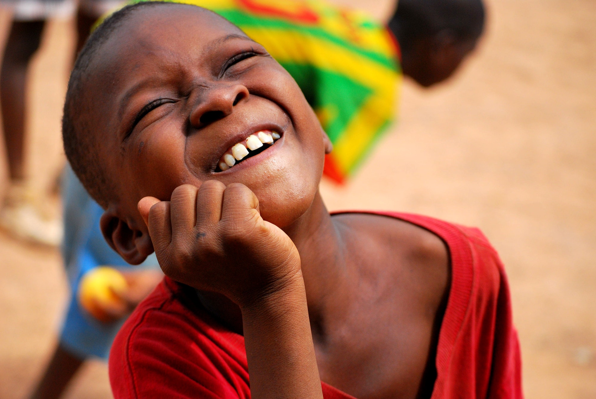African boy (street child) smiling - africa volunteering emotion innocence joy